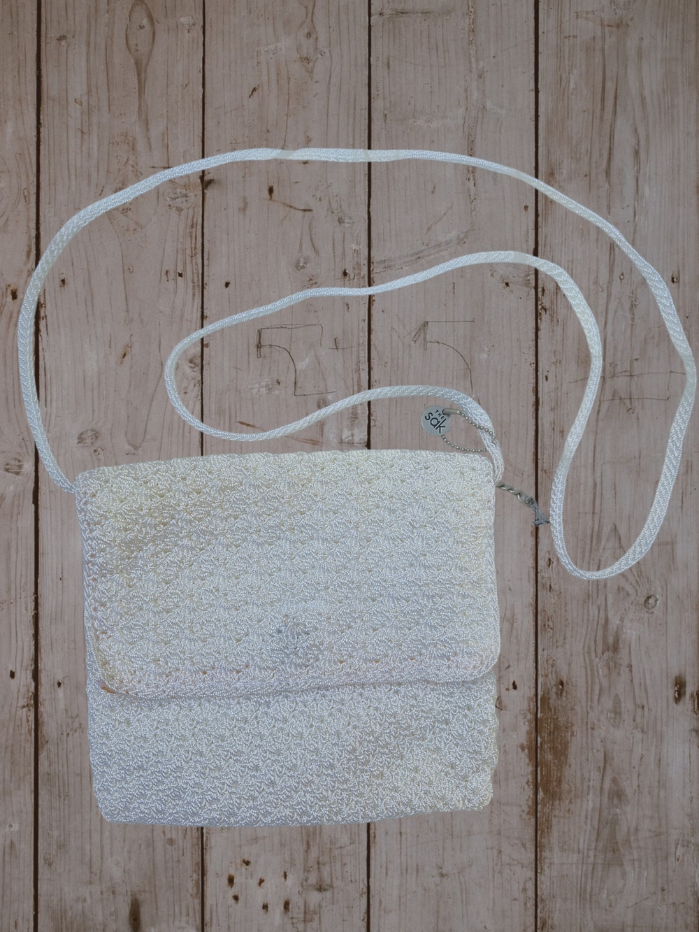 The Sak Cream Woven Crossbody Bag
